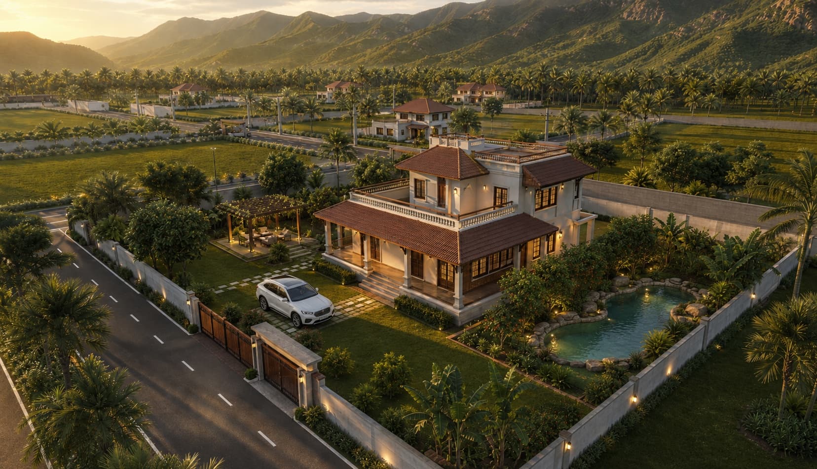 Aerial view of a villa with its own garden and pond inside the gated community, the Velliangiri Mountains glowing at sunset behind — artist's impression